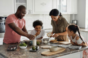 Image of a family preparing a meal.